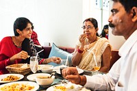 Happy Indian family having Indian food
