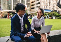 Asian business people working together in a city