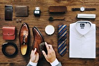 Flatlay view of a businessman cleaning his shoes and his belongings
