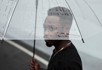 African man using an umbrella
