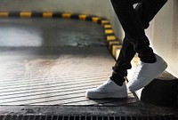 Shot of legs standing on an inclined pavement