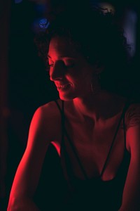 Portrait of a woman in a dark bar