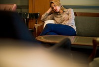 Blond woman waiting at a cafe