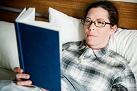 A woman reading in bed