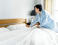 A woman making bed