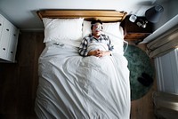 Man sleeping with an anti-snoring mask