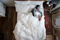 Man sleeping with an anti-snoring mask on