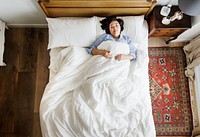Asian woman on the bed sleeping by herself