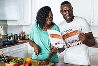 Black couple cooking in the kitchen together