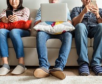 Group of diverse friends using digital devices