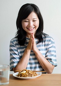 Asian woman about to eat noodles