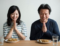 Asian couple about to eat noodles