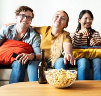 Group of diverse friends having a movie night