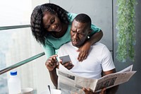 Black couple using mobile phone