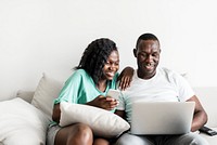 Black couple using digital devices