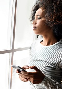 Serious woman using a smartphone
