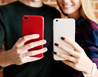 Happy cute young couple using a smartphone