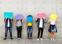 Group of young adults outdoors holding empty placard copyspace thought bubbles