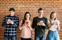 Happy friends using smartphones social media concept