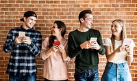 Happy friends using smartphones social media concept