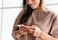 Woman using a smartphone social media conecpt