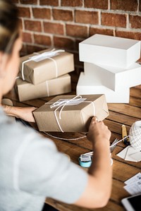 Woman packing parcels