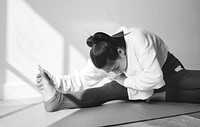 Asian woman stretching leg