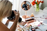 Beauty blogger taking photo of cosmetics