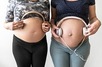 Pregnant woman turn on music for baby