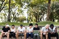 Group of diverse people using digital devices