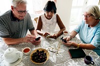 Group of diverse senior people using mobile phone