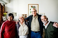 Group of senior friends arms around each other