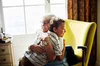 Grandma and grandson hugging together