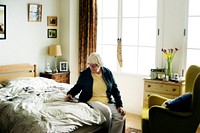 Senior woman sitting on the bed