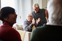 Senior people talking in a living room