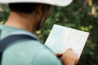 Man finding direction using a map