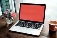 Laptop on a wooden table