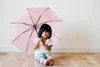 Young Asian girl playing alone