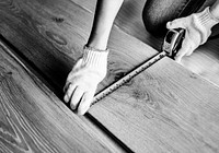 Carpenter man installing wooden floor