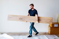 Carpenter man installing wooden floor