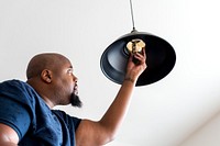 Man changing lightbulb