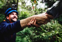 Hand holding hand helping