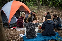 Friends camping in the forest together