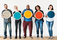 Diverse people holding blank round board
