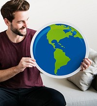 Cheerful man holding globe icon