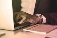 Black businessman using computer laptop
