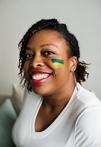 Friends cheering world cup with painted flag