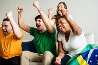 Friends cheering world cup with painted flag