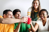 Friends cheering world cup with painted flag