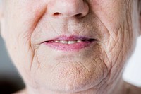 Portrait of white elderly woman closeup on smiling lips